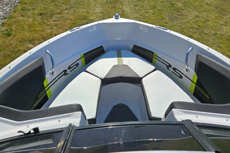Slide: The Image of 2013 Four Winns H190RS boat interior with stylish seating and RS branding. - 11
