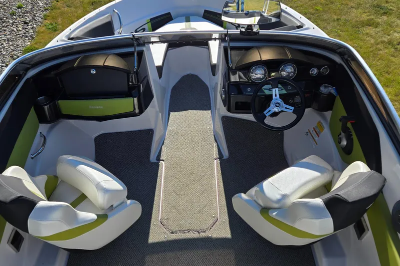 Slide: The Image of 2013 Four Winns H190RS boat interior with steering wheel and seating. - 13