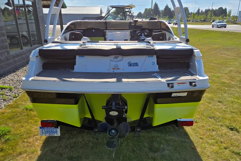 Slide: The Image of Rear view of a 2013 Four Winns H190RS boat on grass. - 4