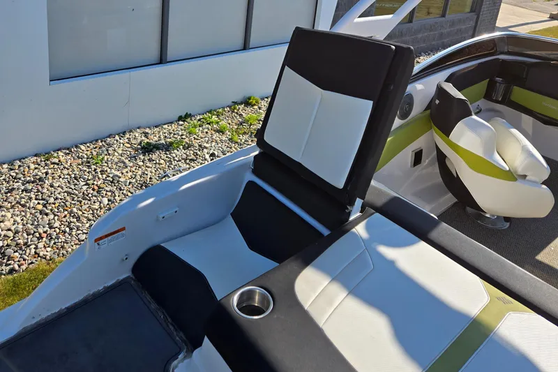 Slide: The Image of 2013 Four Winns H190RS boat interior with stylish seating and cup holder. - 7