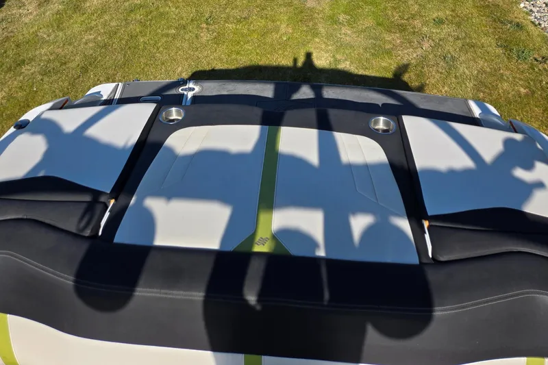 Slide: The Image of 2013 Four Winns H190RS boat interior with shadows on cushioned seating. - 8