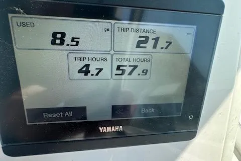 Slide: The Image of Yamaha display showing fuel used, trip distance, trip hours, and total hours on Edgewater 230CX. - 14