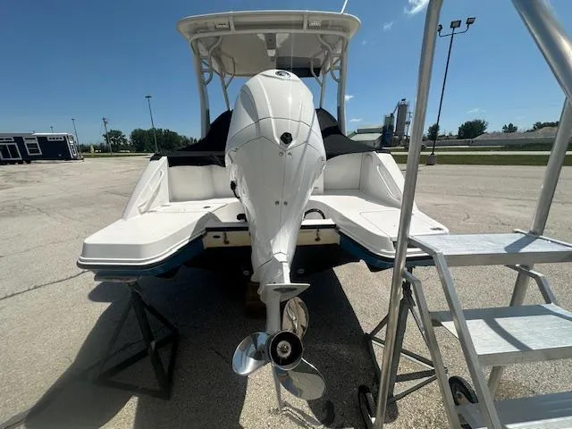 Slide: The Image of 2023 Edgewater 230CX boat model name on window. - 5