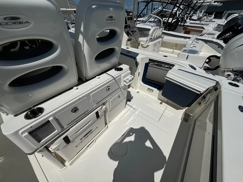 Slide: The Image of 2025 Cobia 265 Center Console boat interior with seating and storage compartments. - 22