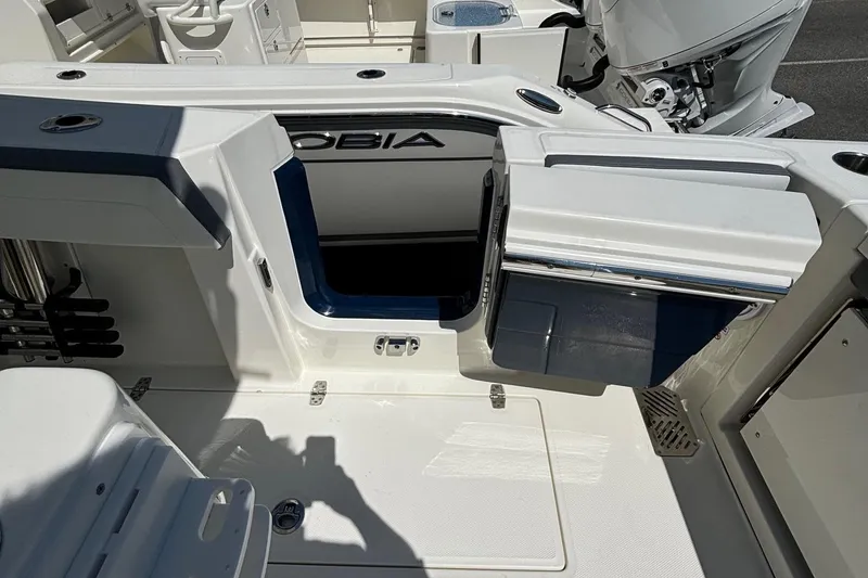 Slide: The Image of 2025 Cobia 265 Center Console boat interior with open storage compartment. - 27