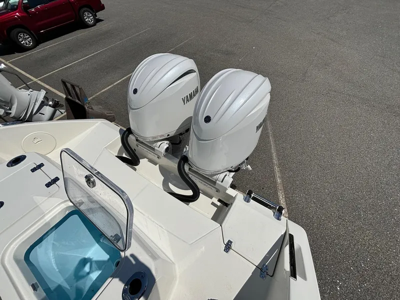 Slide: The Image of 2025 Cobia 265 Center Console with dual Yamaha outboard engines. - 31