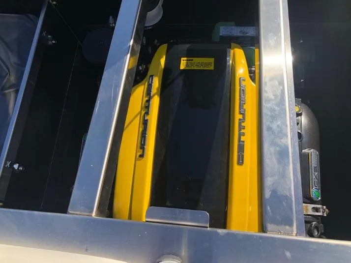 Slide: The Image of 2022 Centurion Ri 230 engine with yellow cover, viewed from above. - 12