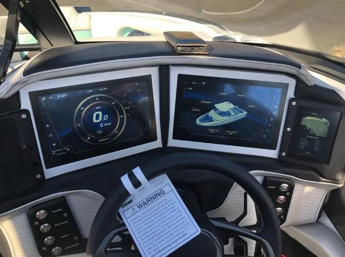 Slide: The Image of Dashboard of a 2022 Centurion Ri 230 boat with digital displays and controls. - 18