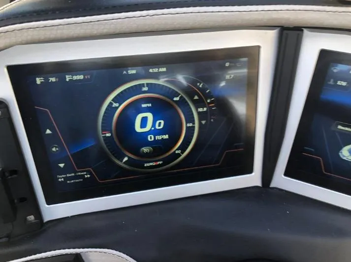 Slide: The Image of Dashboard display of a 2022 Centurion Ri 230 boat showing speed and RPM. - 19