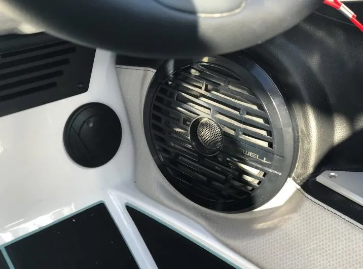 Slide: The Image of Close-up of a 2022 Centurion Ri 230 boat speaker and dashboard details. - 22