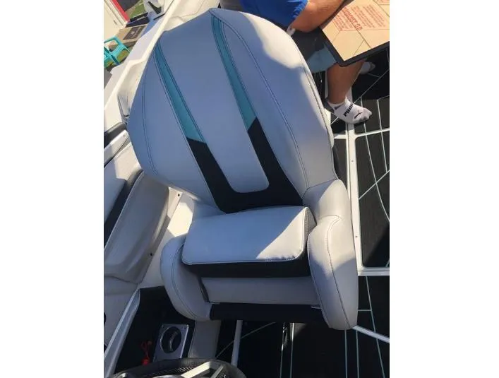 Slide: The Image of Captain's seat in 2022 Centurion Ri 230 boat, featuring sleek design and comfortable upholstery. - 24