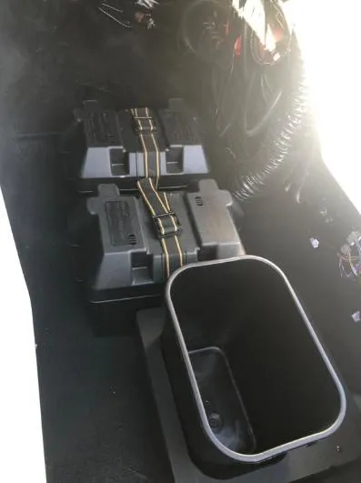 Slide: The Image of 2022 Centurion Ri 230 interior showing battery compartments and storage bin. - 25