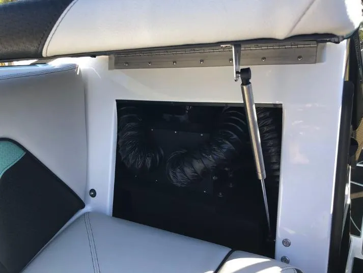 Slide: The Image of 2022 Centurion Ri 230 interior detail with open storage compartment and hydraulic support. - 27