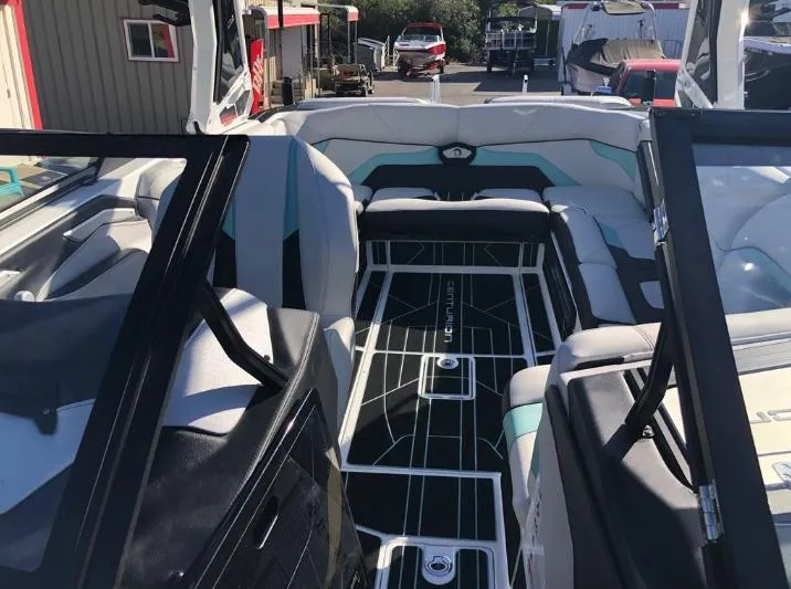 Slide: The Image of Interior of 2022 Centurion Ri 230 boat with modern seating and sleek design. - 33