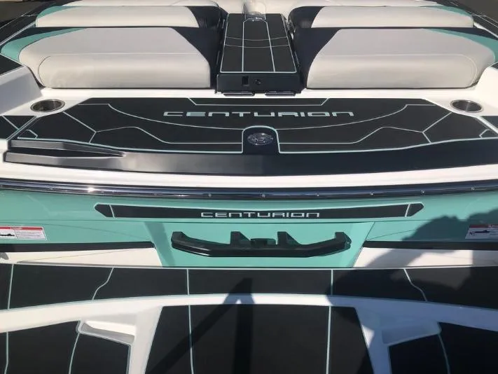 Slide: The Image of 2022 Centurion Ri 230 boat deck with sleek design and branding. - 5