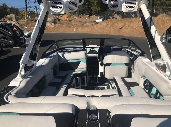 Slide: The Image of 2022 Centurion Ri 230 boat interior with modern seating and audio system. - 6