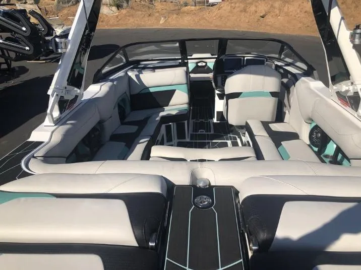 Slide: The Image of 2022 Centurion Ri 230 boat interior with modern seating and sleek design. - 7