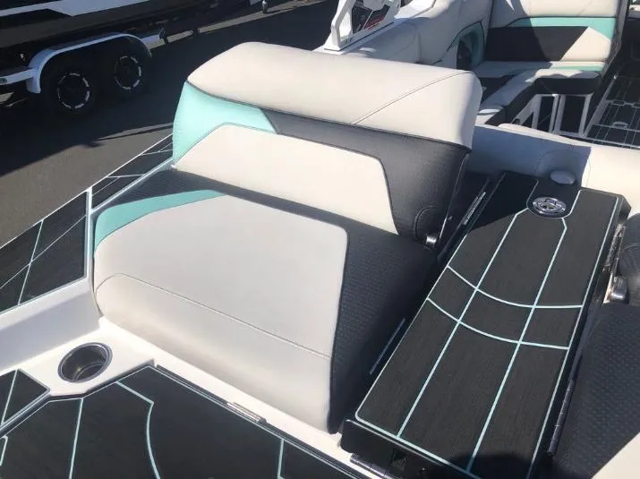 Slide: The Image of 2022 Centurion Ri 230 boat interior with stylish seating and modern design. - 9