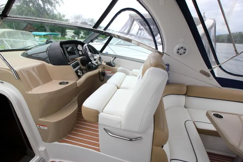 Slide: The Image of Interior of 2008 Four Winns V338 boat with white seating and modern dashboard. - 14