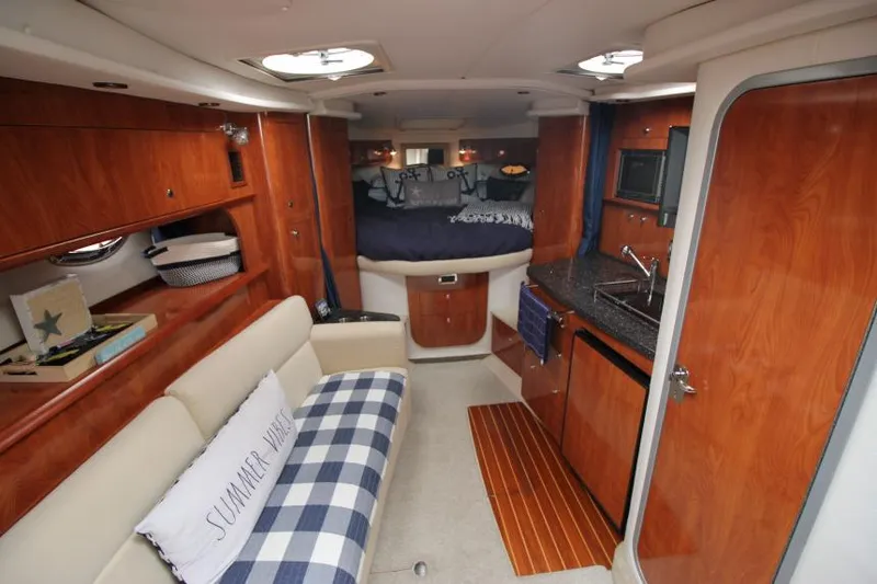 Slide: The Image of Interior of 2008 Four Winns V338 yacht with cozy seating and kitchenette. - 21