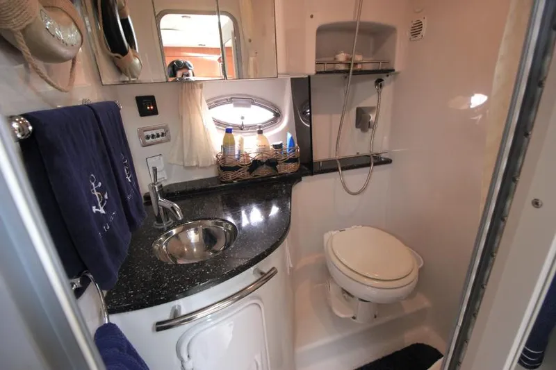 Slide: The Image of 2008 Four Winns V338 yacht bathroom with sink, toilet, and shower. - 27