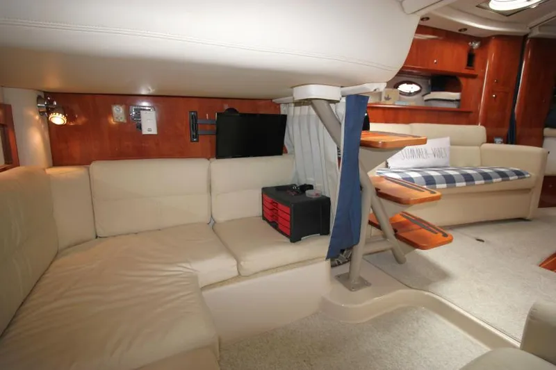 Slide: The Image of Interior of 2008 Four Winns V338 yacht with beige seating and wooden accents. - 29