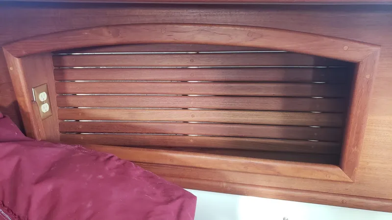 Slide: The Image of Wooden interior detail of a 1991 Pacific Seacraft 34 sailboat cabin. - 16