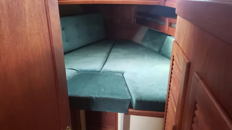 Slide: The Image of Cozy cabin interior of 1991 Pacific Seacraft 34 sailboat with teal cushions. - 21