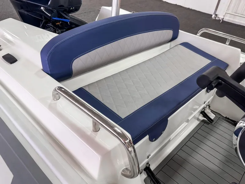 Slide: The Image of 2023 Northstar Axis 4.2 boat seat with blue and gray upholstery. - 4