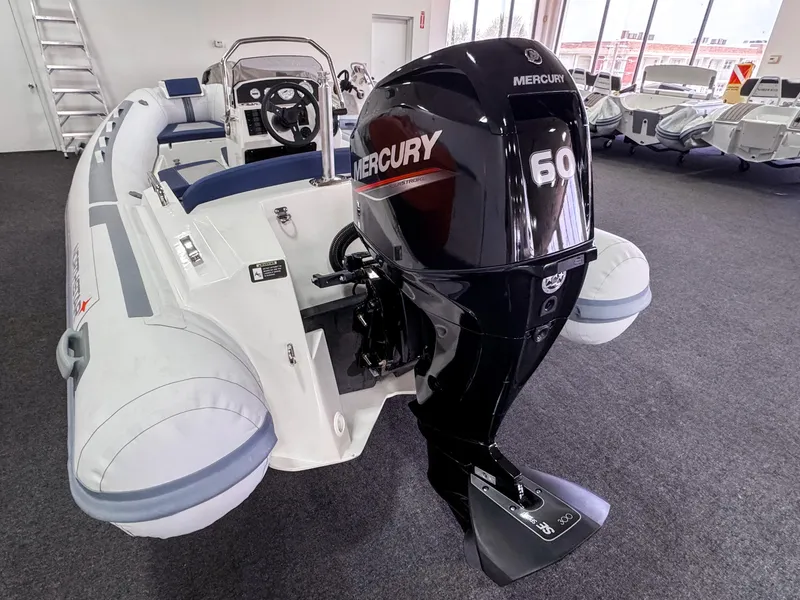 Slide: The Image of 2023 Northstar Axis 4.2 boat with Mercury 60 outboard motor in showroom. - 7