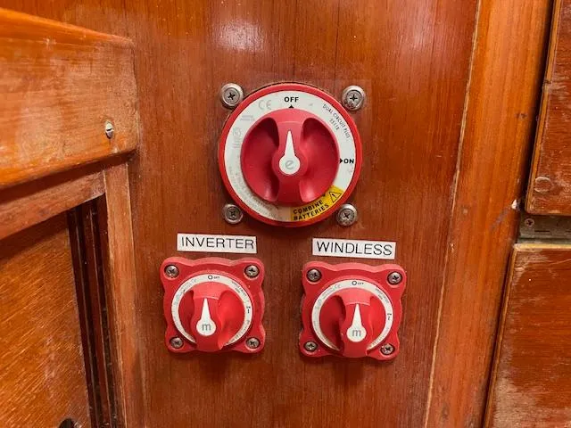 Slide: The Image of Red electrical switches on a 1972 Fastnet Le Comte boat panel. - 10