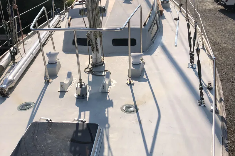Slide: The Image of 1972 Fastnet Le Comte sailboat deck with railings and fittings. - 5