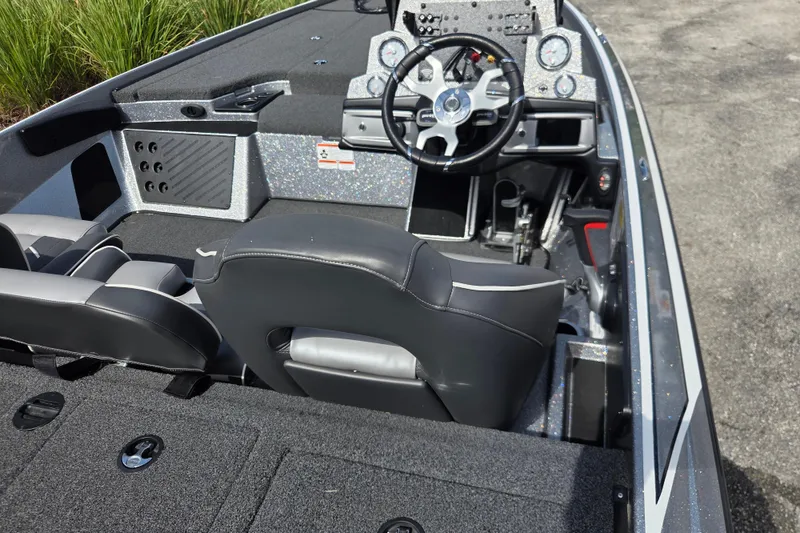 Slide: The Image of 2023 Nitro Z19 Pro boat interior with steering wheel and seating. - 2