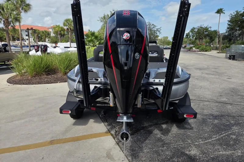 Slide: The Image of 2023 Nitro Z19 Pro boat with powerful outboard motor, parked on a sunny day. - 3