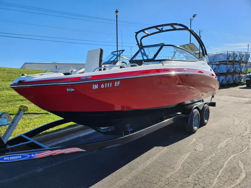 Slide: The Image of 2016 Yamaha Boats 242 Limited S, red, on trailer, parked outdoors. - 5