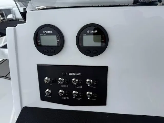Slide: The Image of Control panel of 2025 Wellcraft 202 Fisherman boat with Yamaha gauges and switches. - 6