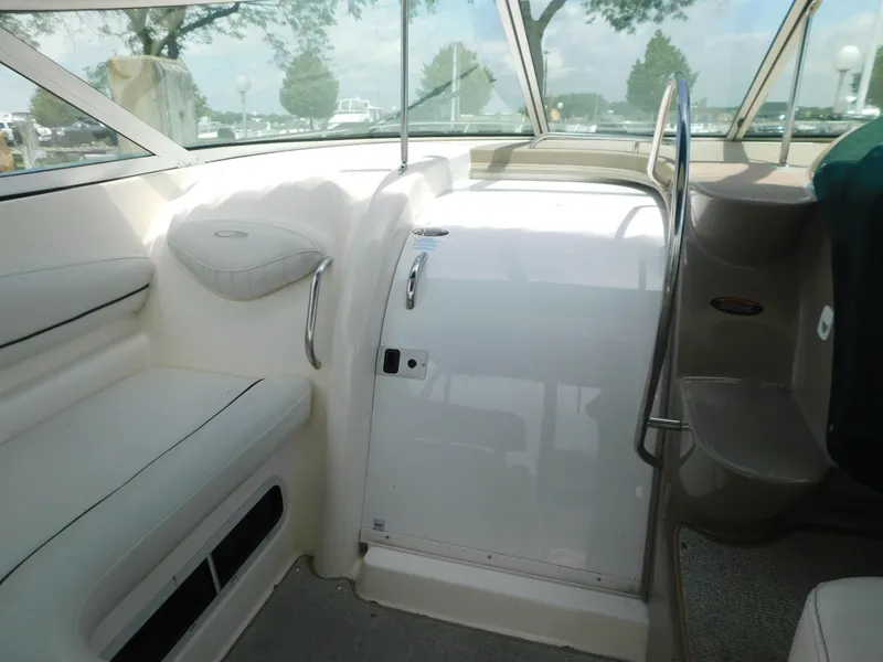 Slide: The Image of 2003 Maxum 3500 SY boat interior with seating and helm area. - 12