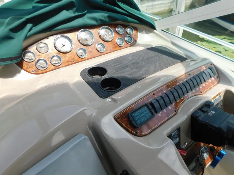 Slide: The Image of Control panel of a 2003 Maxum 3500 SY boat with gauges and switches. - 14