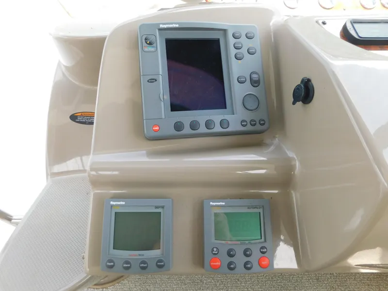 Slide: The Image of Control panel of a 2003 Maxum 3500 SY boat with Raymarine navigation equipment. - 17