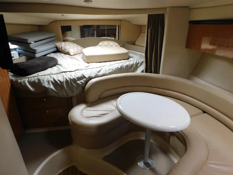 Slide: The Image of Interior of 2003 Maxum 3500 SY yacht with cozy seating and bed area. - 20