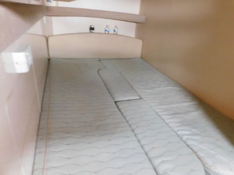 Slide: The Image of Interior cabin of 2003 Maxum 3500 SY boat with cushioned sleeping area. - 25