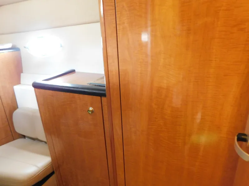 Slide: The Image of Interior of 2003 Maxum 3500 SY yacht with wooden cabinetry and seating. - 27