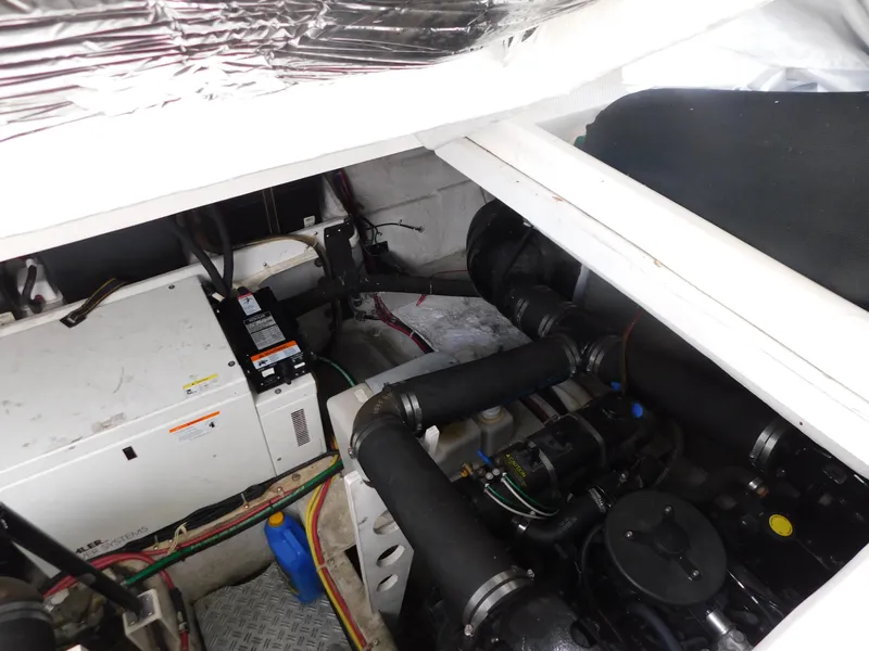 Slide: The Image of Engine compartment of 2003 Maxum 3500 SY boat, showing mechanical components and wiring. - 35