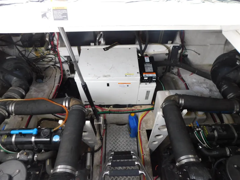 Slide: The Image of Engine compartment of a 2003 Maxum 3500 SY boat, showing mechanical components and wiring. - 36