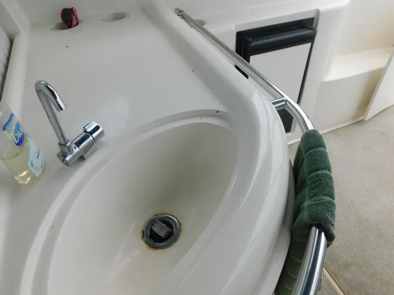 Slide: The Image of 2003 Maxum 3500 SY boat sink with faucet and towel. - 37