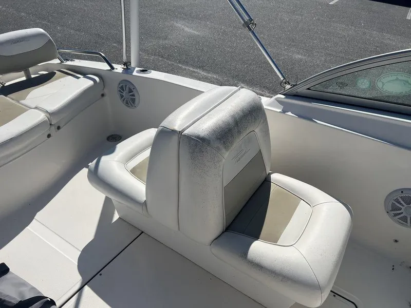 Slide: The Image of 2012 Pioneer 175 Venture boat interior with white seating and speaker. - 12