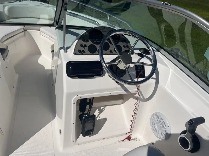 Slide: The Image of 2012 Pioneer 175 Venture boat cockpit with steering wheel and control panel. - 13