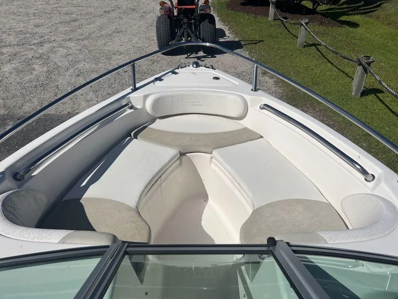 Slide: The Image of 2012 Pioneer 175 Venture boat interior with cushioned seating and metal railings. - 14