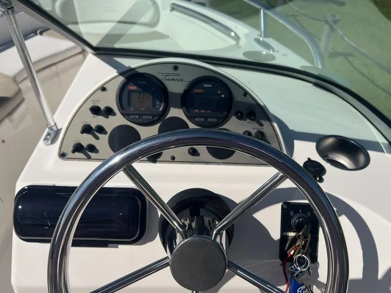 Slide: The Image of Steering wheel and dashboard of 2012 Pioneer 175 Venture boat. - 15
