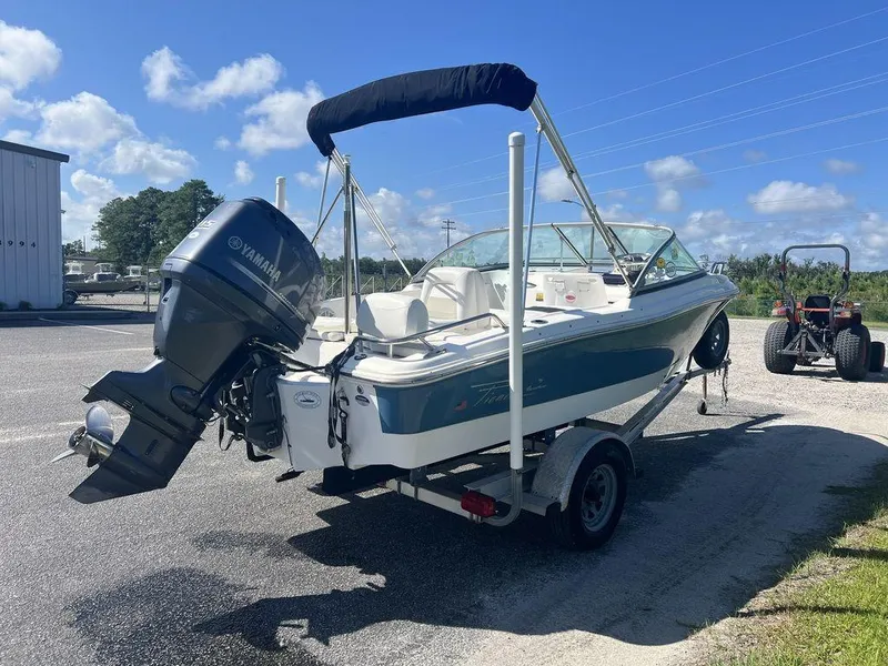 Slide: The Image of 2012 Pioneer 175 Venture boat with Yamaha outboard motor on trailer, parked outdoors. - 5